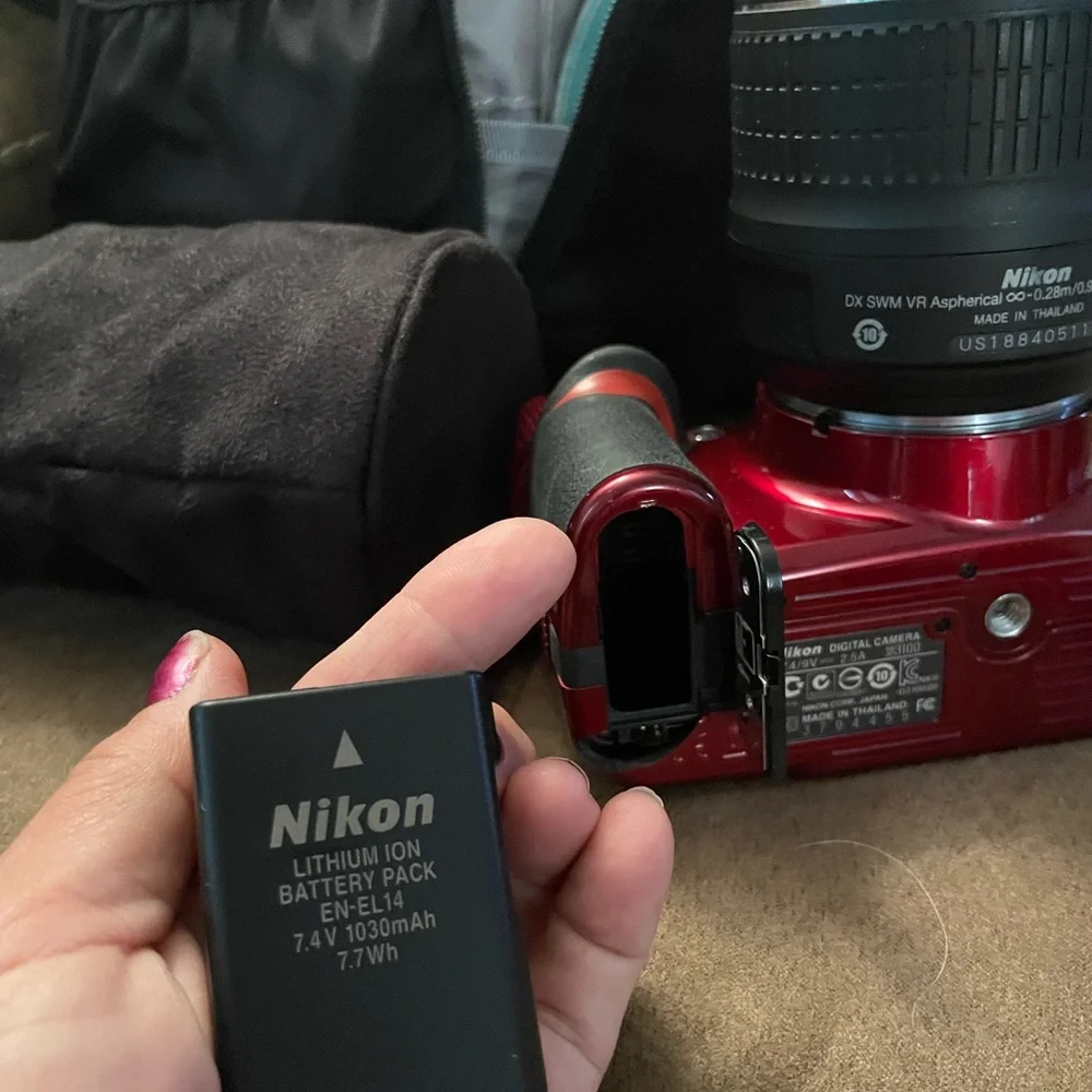 Nikon D3100 new camera has 2 batteries charger extra lens and carrying case